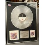 Platinum disc sales for Chris Rea Dancing with Strangers