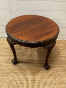A circular side table on ball and claw feet (H46cm Dia60cm)