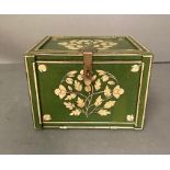 A small green painted wooden collectors box with a golden floral releif