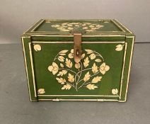 A small green painted wooden collectors box with a golden floral releif