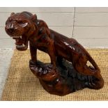 A Chinese carved prowling tiger (H60cm) AF