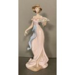 A Lladro lady with a basket of flowers