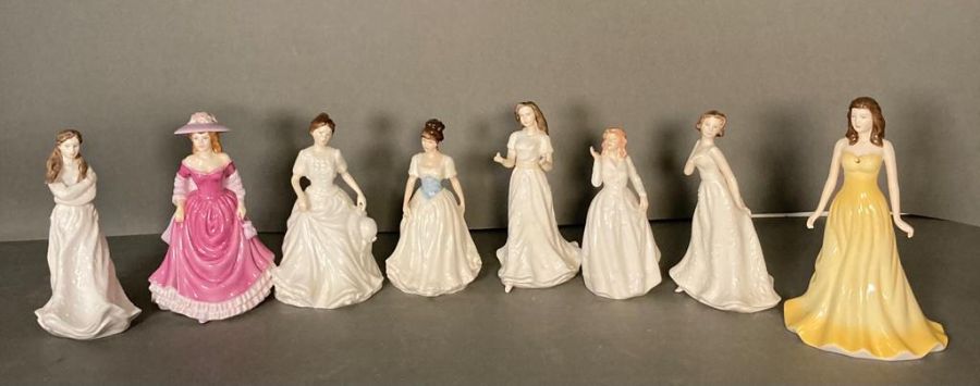 A selection of eight Royal Doulton figures to include Embrace, Summer Breeze and Harmony