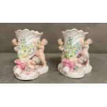 A pair of 19th Century French Putti vases H12cm