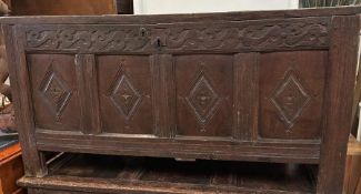 An oak early 18th Century four carved panelled coffer. (H62cm D53cm W120cm)