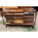 A Haberdashery counter with graduated drawers and glazed sides (the top has been smashed) (H90cm
