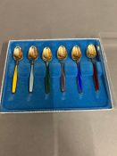 A boxed set of six enamel sterling silver spoons. Norway