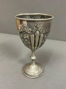 A large goblet with repousse detail to outside on a footed base (H18cm)