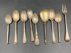 A selection of silver spoons and a fork