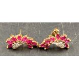 A pair of 9ct gold earrings with ruby style stones.