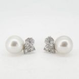 A pair of trefoil diamond and pearl earrings 18 carat gold.Total diamond weight 1.96cts Pearls 12.