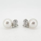 A pair of trefoil diamond and pearl earrings 18 carat gold.Total diamond weight 1.96cts Pearls 12.