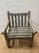 An impressive teak garden arm chair (H87cm W67cm D69cm)