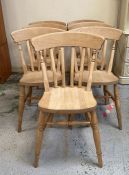 A set of eight pine slat back farmhouse chairs