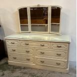 A seven drawer white dressing table with three panelled vanity mirror (H72cm W143cm D47cm)
