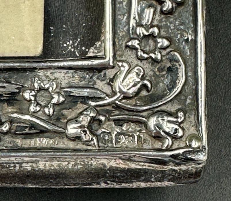 A good Art Nouveau silver embossed photograph frame, Birmingham 1901, together with period 1915 - Image 3 of 5