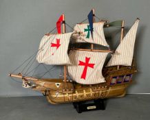 A wooden scale model of the Spanish Galleon Santa Maria on plinth