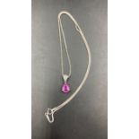 An 18ct pink sapphire and diamond pendant on a fine 18ct white gold necklace (Approximate 0.25ct