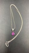 An 18ct pink sapphire and diamond pendant on a fine 18ct white gold necklace (Approximate 0.25ct