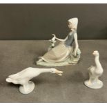 Three Lladro figures of Geese and a lady siting