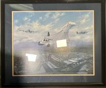 A large framed print of Concorde in flight flanked by Spitfire