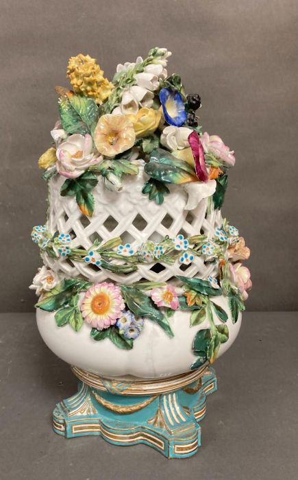 A large porcelain floral centre piece on base by Copeland