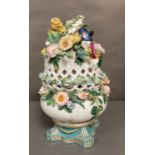 A large porcelain floral centre piece on base by Copeland