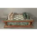 A large Aztec and Spanish wooden resin chess set