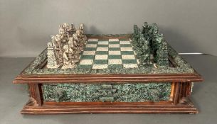 A large Aztec and Spanish wooden resin chess set