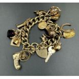 A 9ct gold charm bracelet (Approximate Total weight 93g)