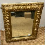 A plaster gilt framed mirror 65cm x 48cm