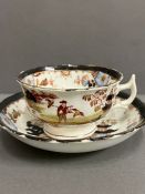 A Porcelain hand painted trio of cup, saucer and side plate. Possibly Minton