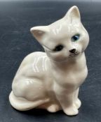 A Royal Doulton porcelain figure of a cat.