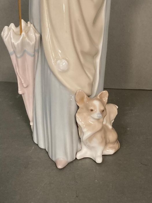 A Lladro lady with umbrella and dog - Image 2 of 4