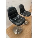 Two faux leather kitchen stools on chrome base