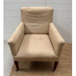 An armchair on castors in need of re-upholstery