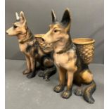 A pair of china German Shepard dogs with baskets on their back