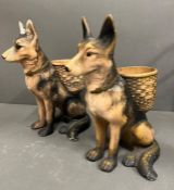 A pair of china German Shepard dogs with baskets on their back