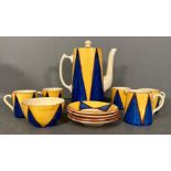 A Clarice Cliff Bizarre Coffee service comprising four coffee cans, sugar bowl, milk jug and