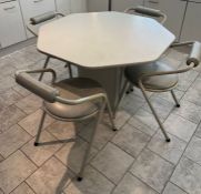 A 1980's white and grey dining table and chairs, octagonal table with tubular frame chairs by