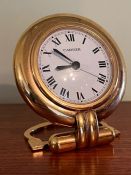 A Cartier Paris Colisee quartz travel clock.