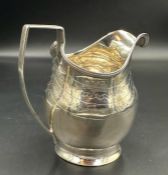 A Georgian silver milk jug, hallmarked for London 1802, approximate total weight 115g