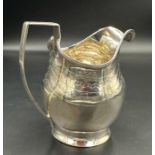 A Georgian silver milk jug, hallmarked for London 1802, approximate total weight 115g