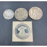 A selection of USA Coins to include: 1923 dollar, 1926 dollar, 1942 half dollar, Leavenworth