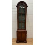 A mahogany dome topped display cabinet with two shelves and cupboard under (H 180cm x D 26cm x W