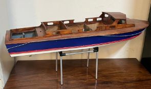 A wooden model boat (90cm x 26cm)