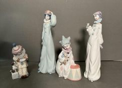 A selection of four Lladro clowns to include perriot and his puppy