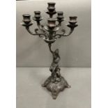 An Art Nouveau style candelabra with six candle holders on scrolling arms