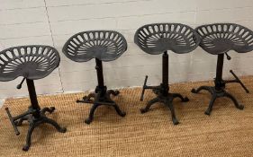 Four reproduction tractor stools