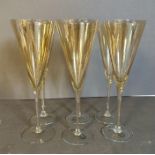 A set of six smoked Romanian glass champagne flutes